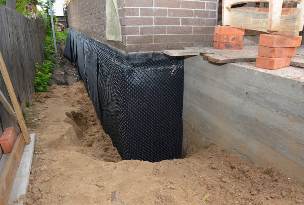 SJ Waterproofing Pros technician performing targeted Waterproofing assessment in Milford Square, PA